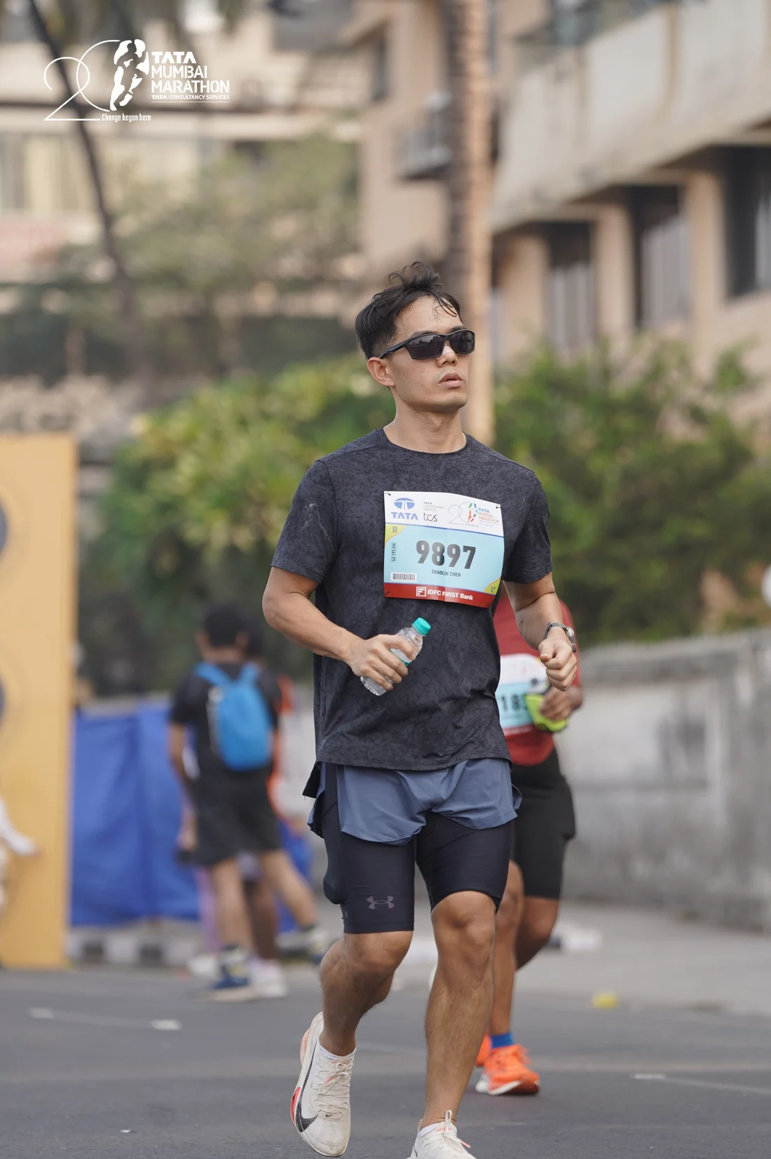 Shaolin Chen running the Tata Mumbai Marathon in 2025, wearing race bib 9897